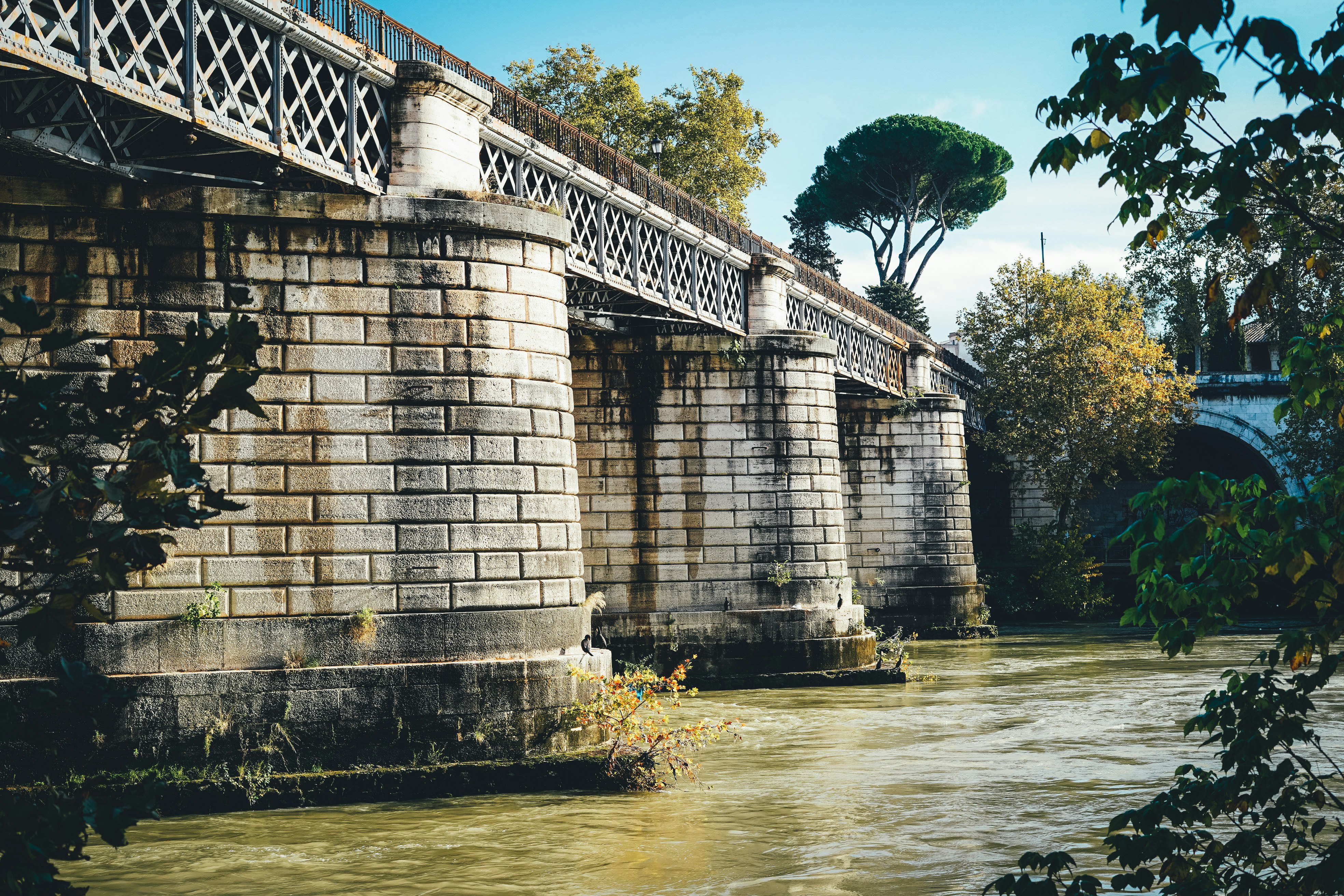 gray concrete bridge over a body of water